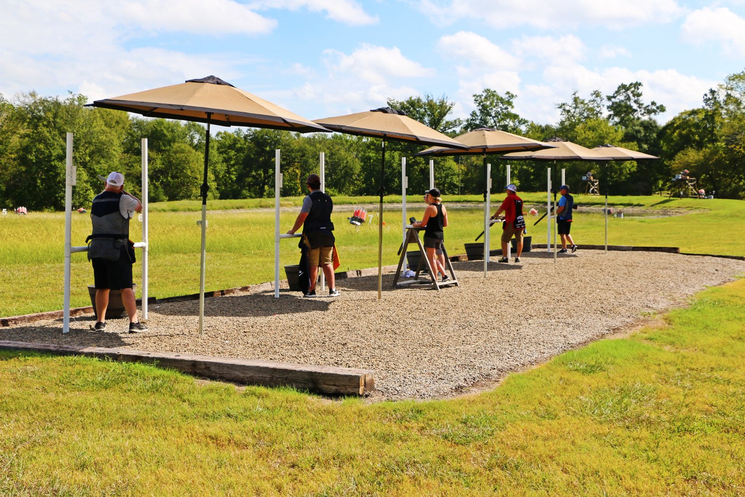 Shooters on the covered 5-stand line at Able's Gun Club